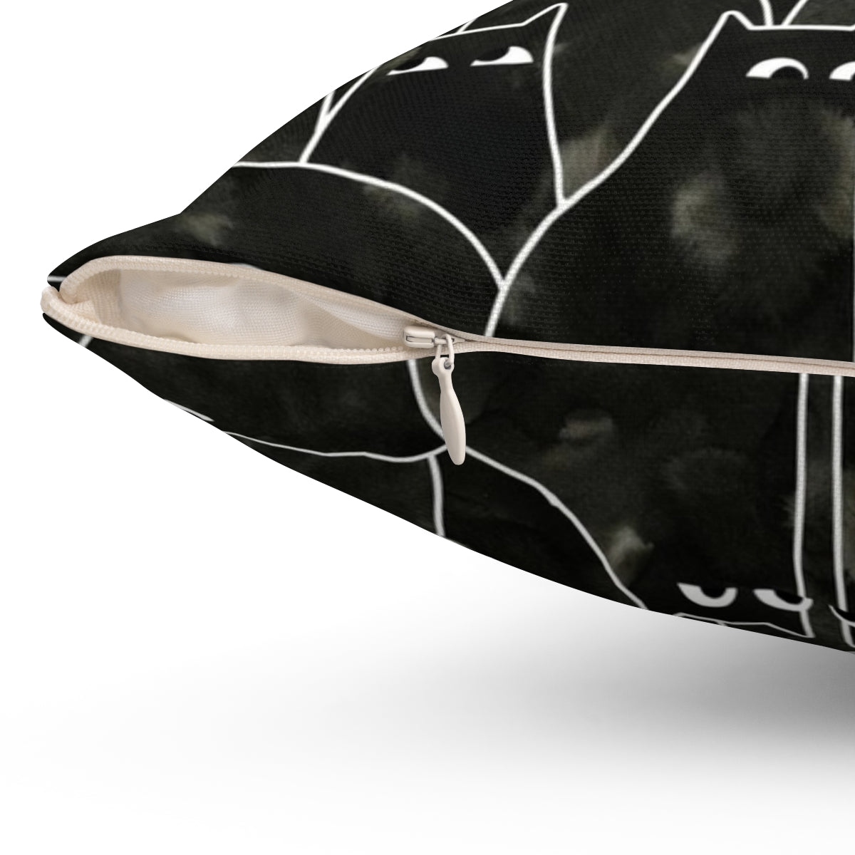 Whimsical illustration of a suspicious-looking black cat on a decorative throw pillow - Detail