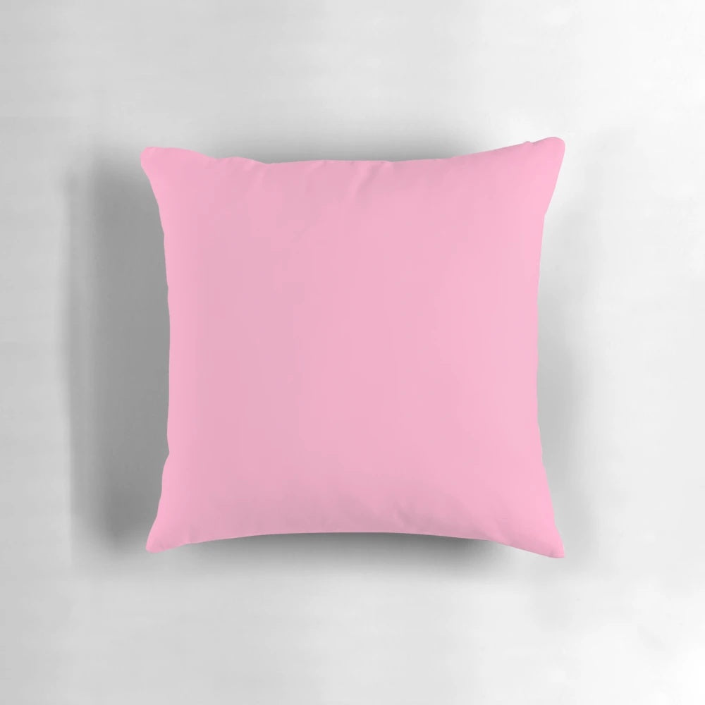 A soft, solid pink throw pillow with a vibrant 100 shades of pink design.