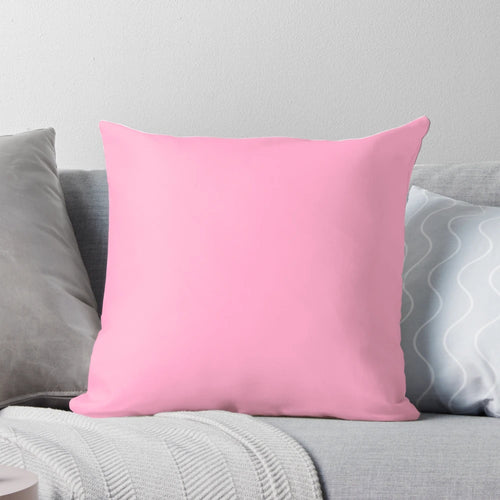 A soft, solid pink throw pillow with a vibrant 100 shades of pink design.
