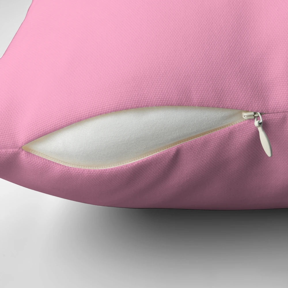 A soft, solid pink throw pillow with a vibrant 100 shades of pink design.