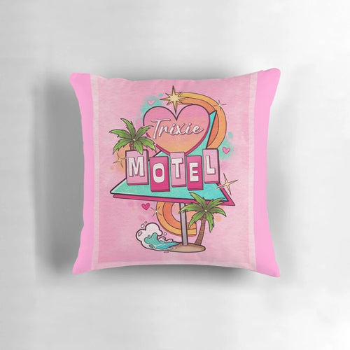A decorative throw pillow featuring a 1960s-style motel sign with the text "Trixie Motel" in a pink and white color scheme.