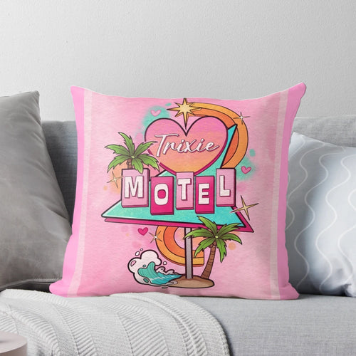 A decorative throw pillow featuring a 1960s-style motel sign with the text "Trixie Motel" in a pink and white color scheme.