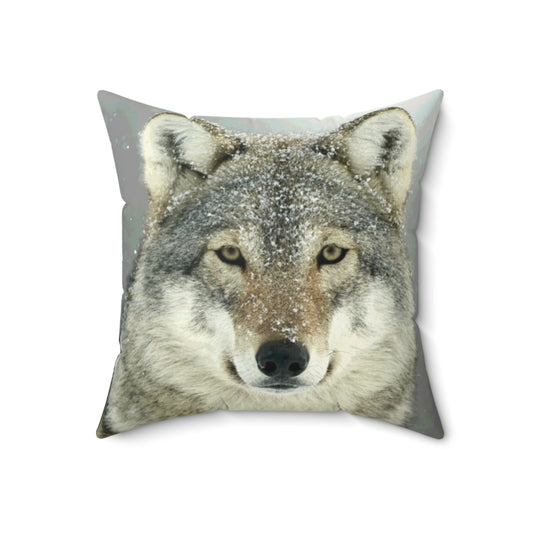 A grey wolf-inspired decorative throw pillow featuring a wilderness design