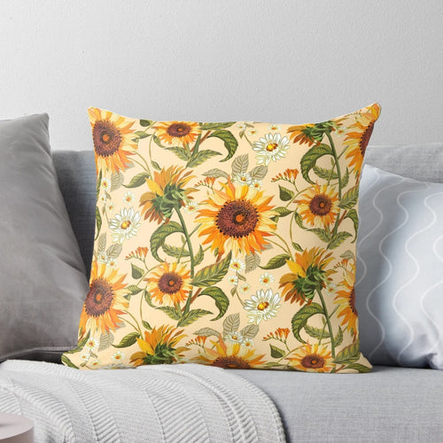 Vibrant sunflower pattern in shades of yellow and orange on a throw pillow, evoking a retro 70s aesthetic.