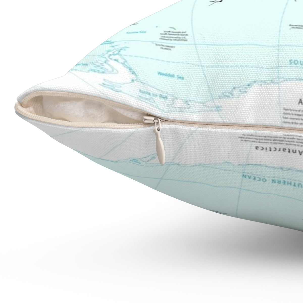 A throw pillow featuring the travel quote "I haven't been everywhere but it's on my list" with a compass rose and world map design. - Detail