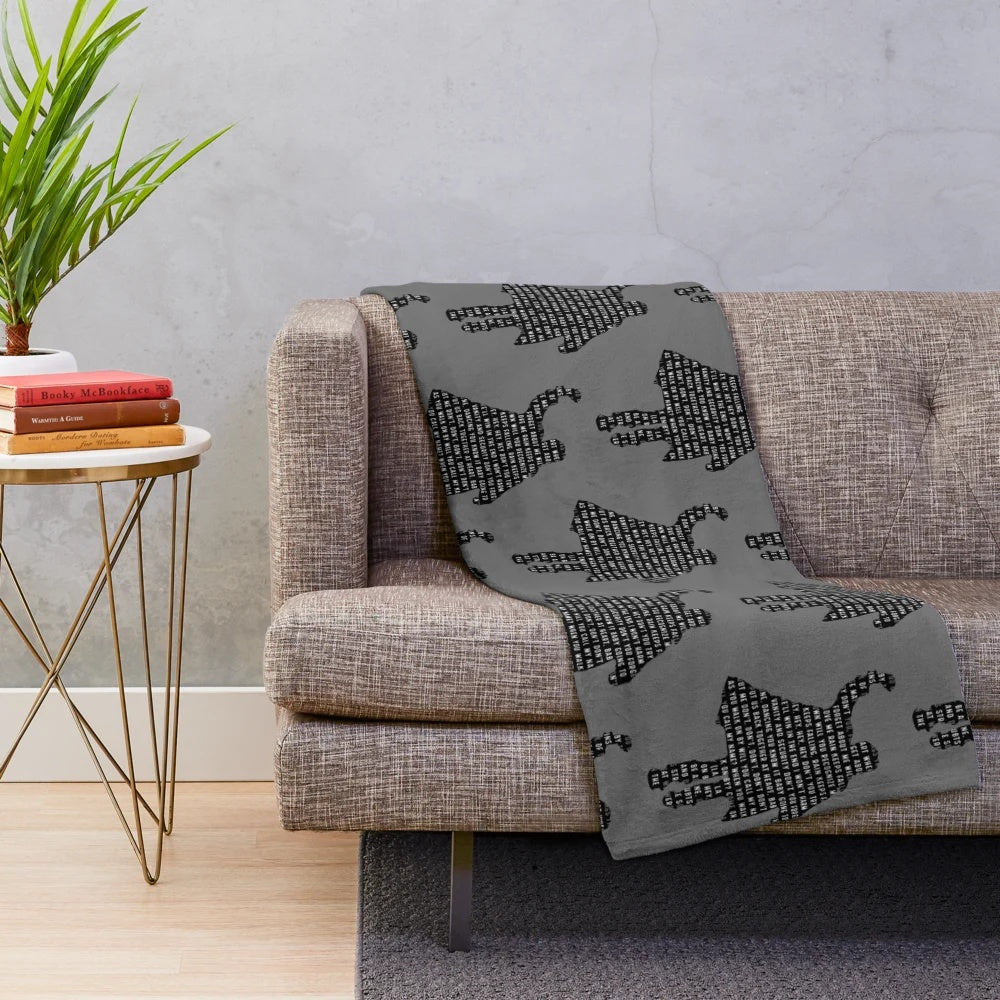 Plush blanket featuring 1980s movie characters and references