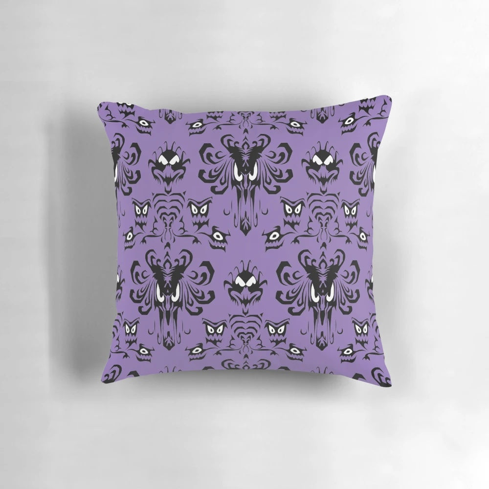 999 Happy Haunts Pillow featuring a haunted mansion with creepy eyes and grim grinning ghosts
