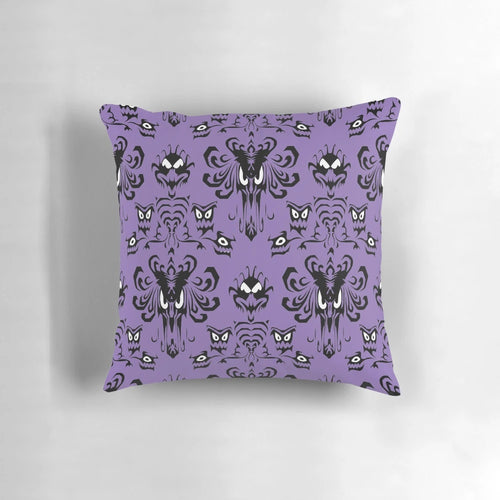 999 Happy Haunts Pillow featuring a haunted mansion with creepy eyes and grim grinning ghosts