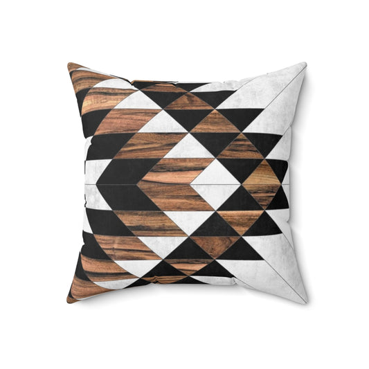 Decorative tribal patterned pillow with concrete and wood elements