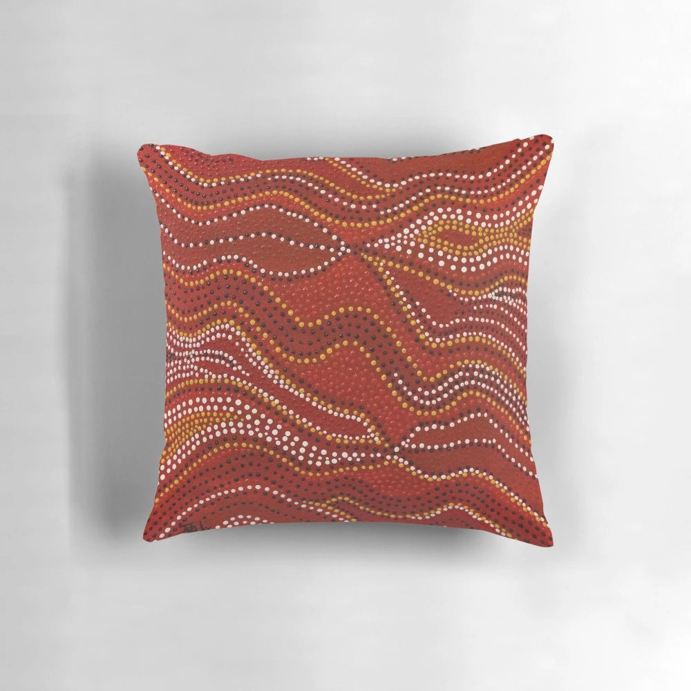 Aboriginal-inspired stone country pillow with dotted design by Australian indigenous artist David Peake
