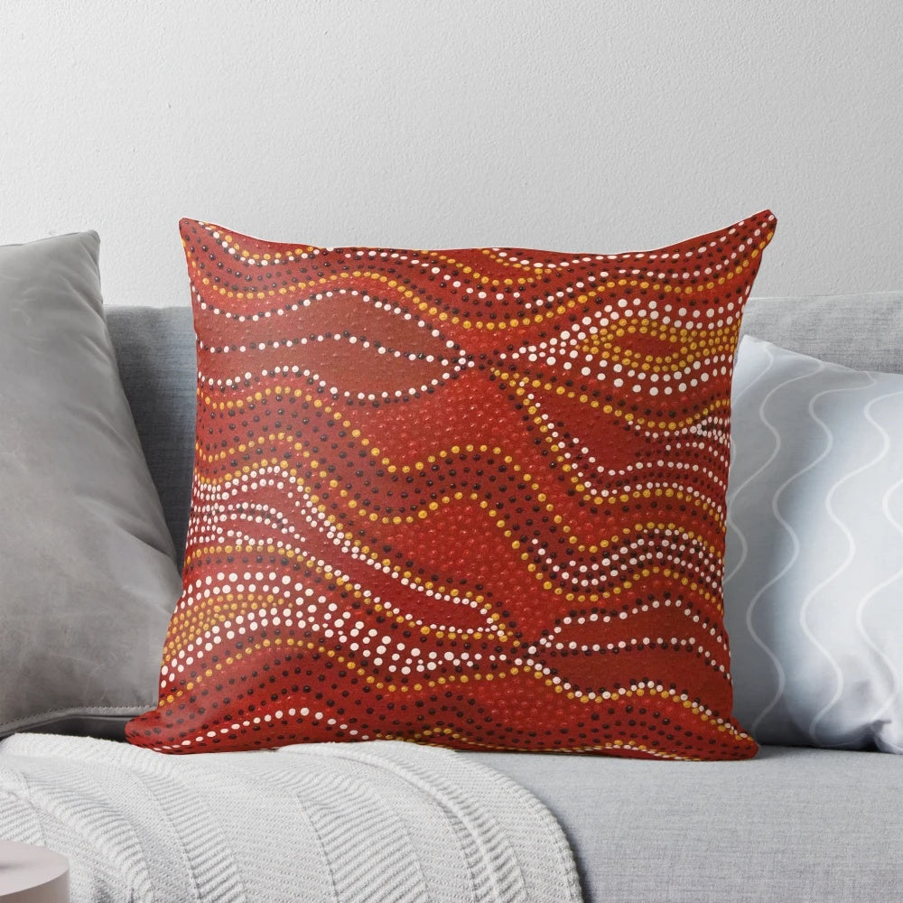 Aboriginal-inspired stone country pillow with dotted design by Australian indigenous artist David Peake