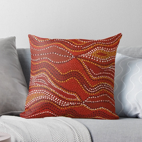 Aboriginal-inspired stone country pillow with dotted design by Australian indigenous artist David Peake