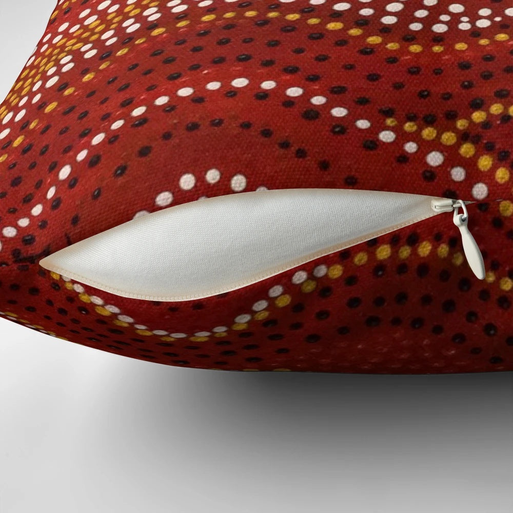 Aboriginal-inspired stone country pillow with dotted design by Australian indigenous artist David Peake