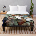 An abstract plush blanket featuring a collage of six guitars