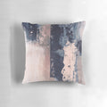 Horizontal abstract art pillow in shades of blush pink and navy blue, featuring brushstrokes and a modern, industrial-style design.
