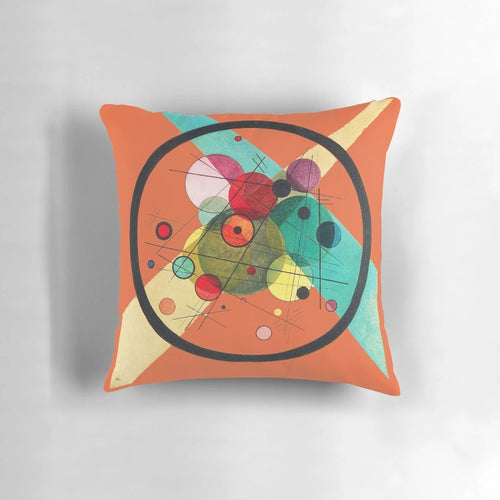 Decorative pillow featuring an abstract circle pattern inspired by the iconic artwork of Wassily Kandinsky.