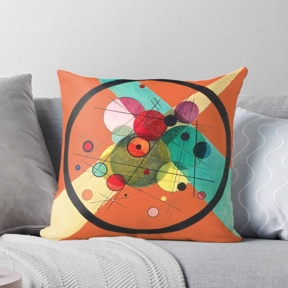 Decorative pillow featuring an abstract circle pattern inspired by the iconic artwork of Wassily Kandinsky.