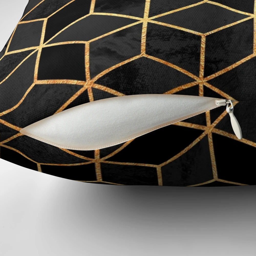 Black and gold modern minimalist pillow with abstract geometric cube and hexagon pattern