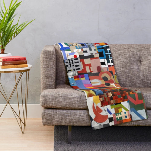Soft, plush blanket with abstract geometric design inspired by the work of Swiss artist Sophie Taeuber-Arp