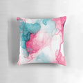 Abstract geometric pattern in teal and pink colors on a plush decorative pillow for home decor