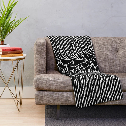 Plush blanket featuring the iconic abstract album art design of the Unknown Pleasures album