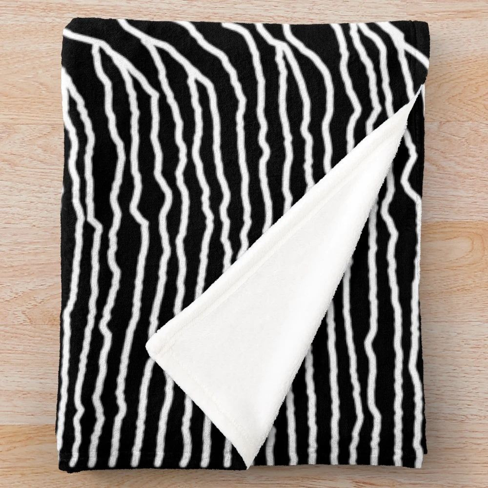 Plush blanket featuring the iconic abstract album art design of the Unknown Pleasures album