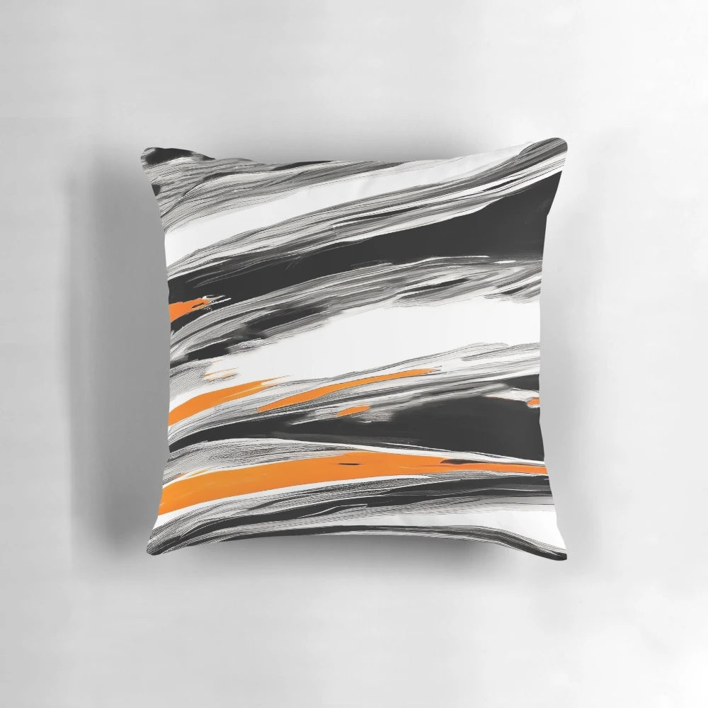 An abstract, circular pattern decorative pillow in shades of orange, gray, and black with paint brush strokes.