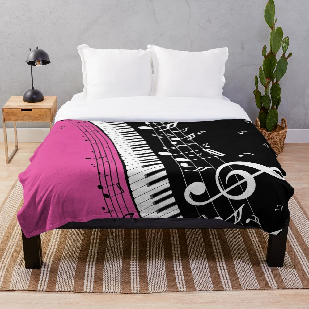 Plush blanket featuring an abstract design of a piano keyboard with musical notes