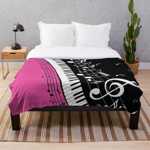 Plush blanket featuring an abstract design of a piano keyboard with musical notes