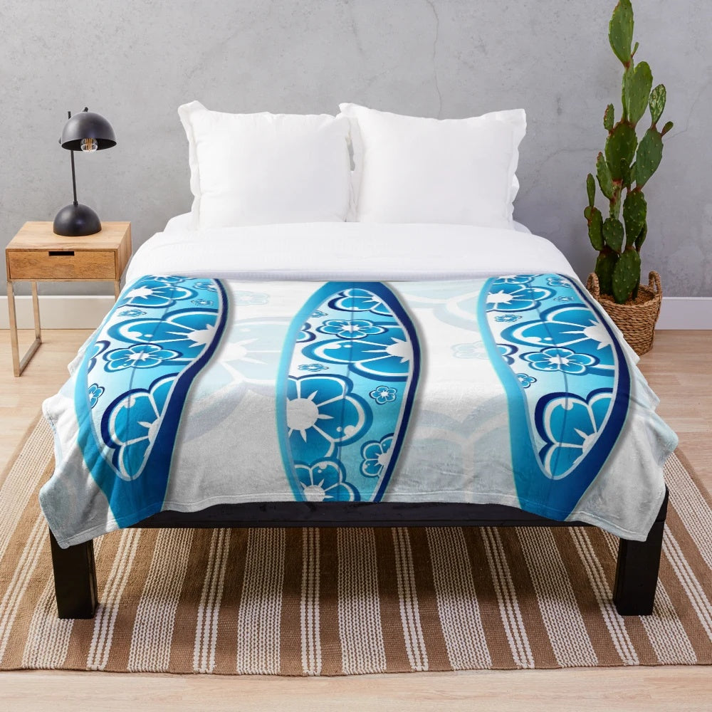 Colorful abstract surfboards design on a plush blanket