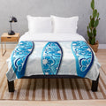 Colorful abstract surfboards design on a plush blanket