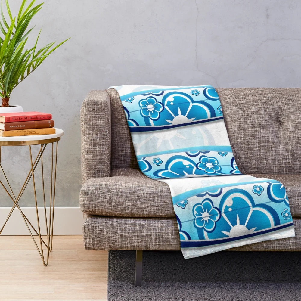 Colorful abstract surfboards design on a plush blanket