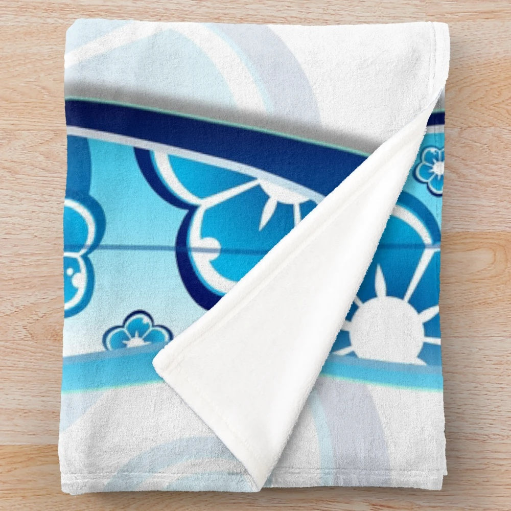 Colorful abstract surfboards design on a plush blanket