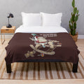 Plush blanket featuring an absurdist design inspired by young wine and cowboy cinema