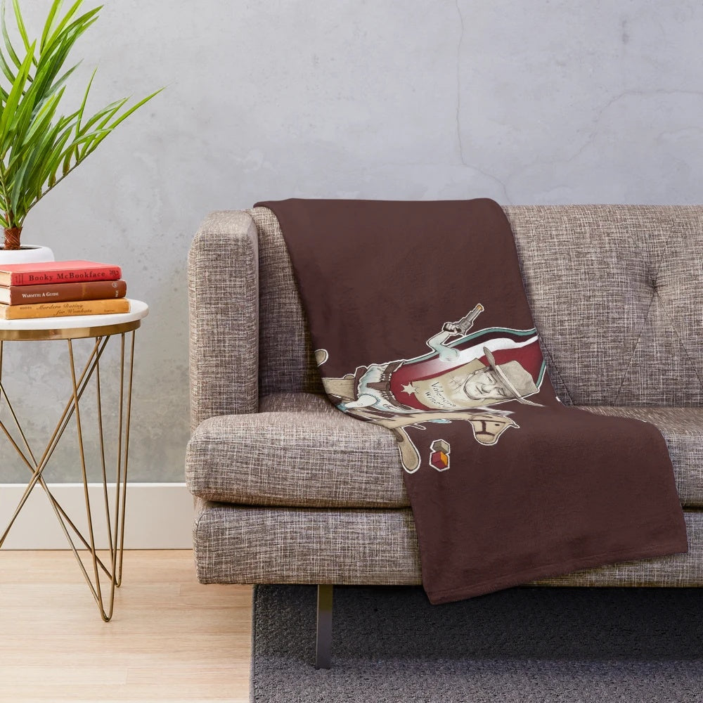Plush blanket featuring an absurdist design inspired by young wine and cowboy cinema
