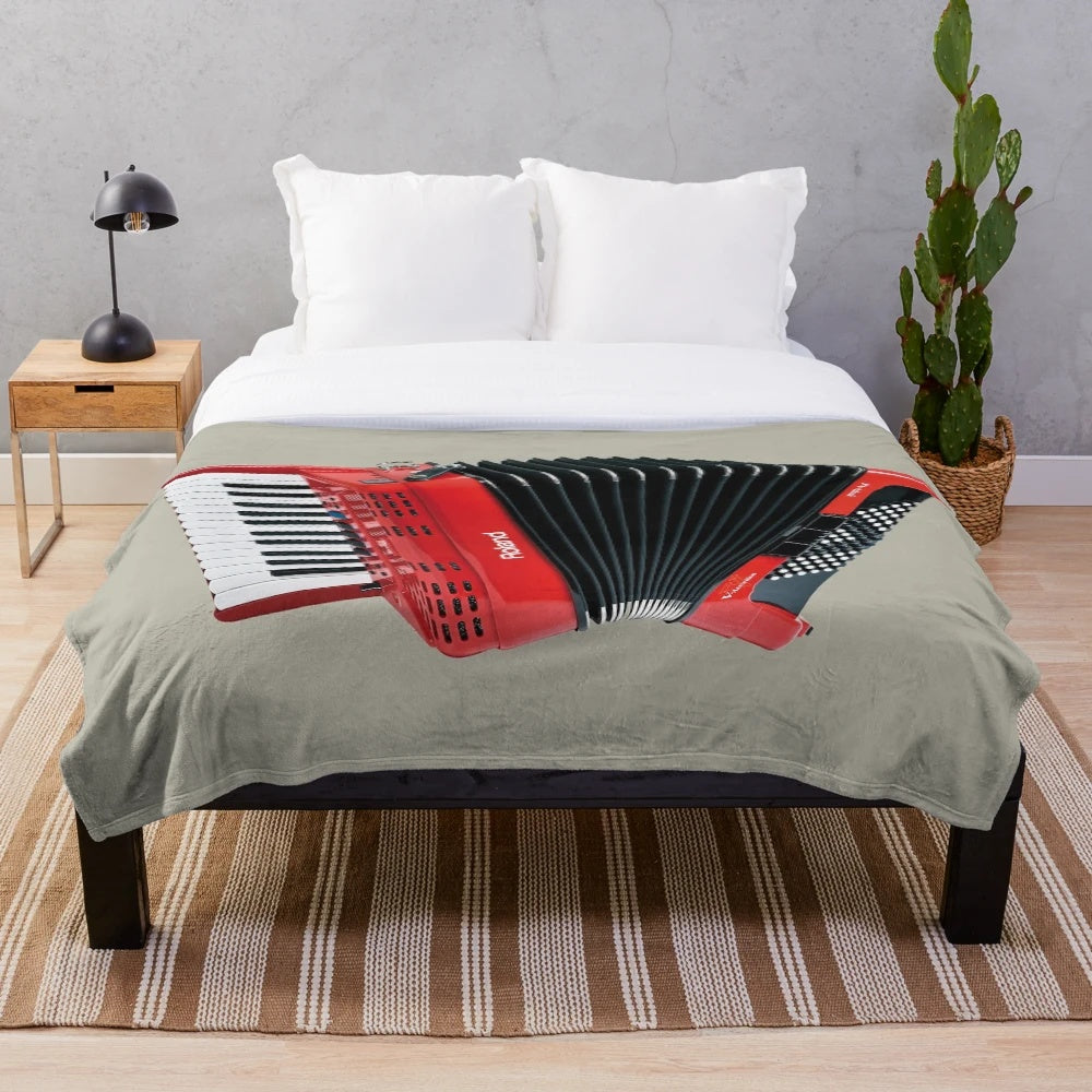 Accordion-themed plush blanket with musical instrument imagery