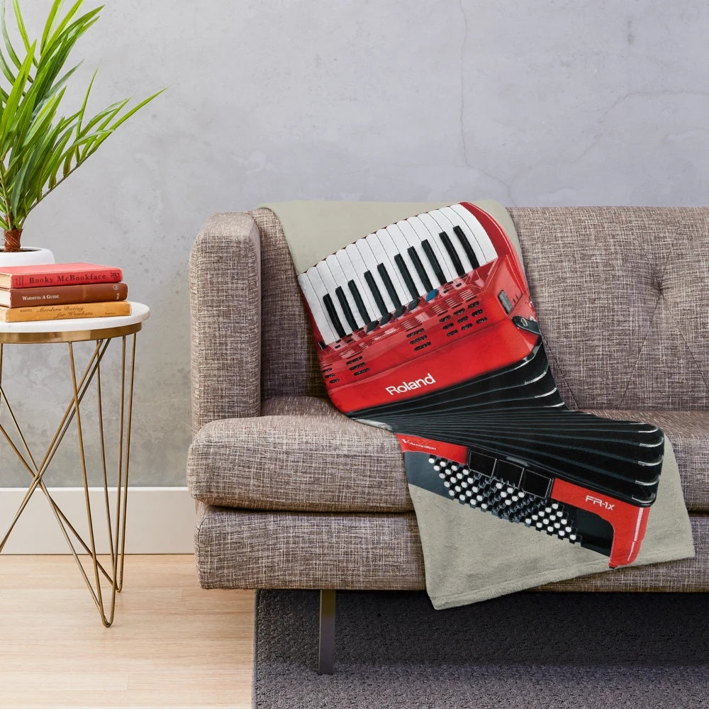 Accordion-themed plush blanket with musical instrument imagery