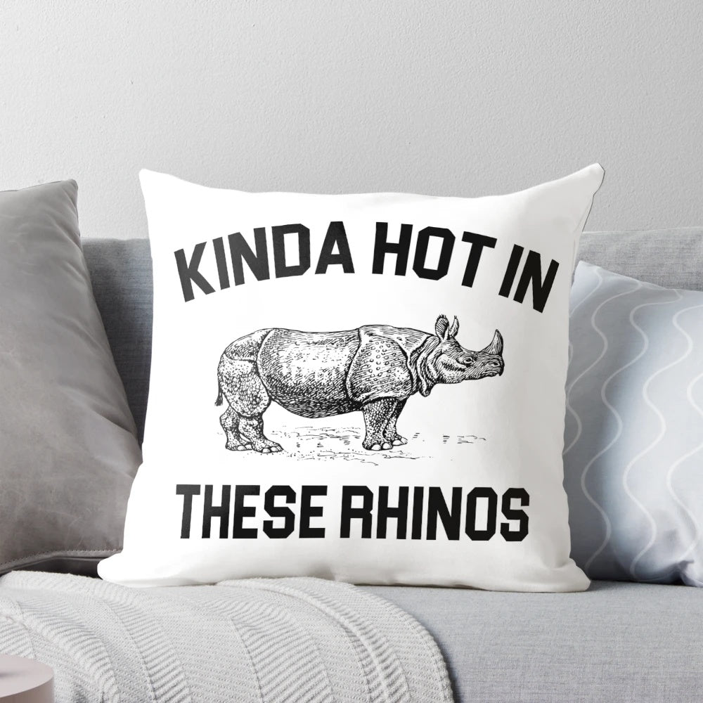 Ace Ventura "Kinda Hot in These Rhinos" quote printed on a pillow with a rhino illustration