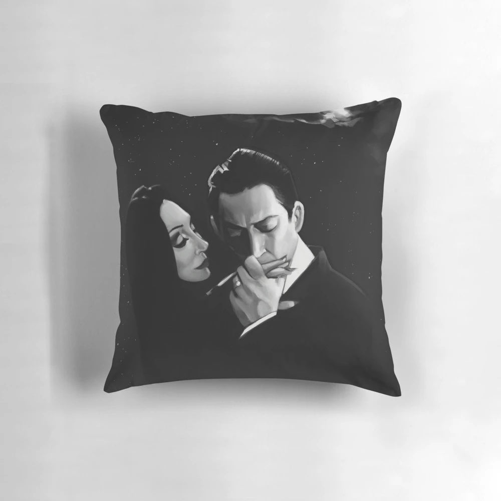 Decorative pillow featuring Gomez and Morticia Addams from the Addams Family in a romantic, gothic-inspired design.
