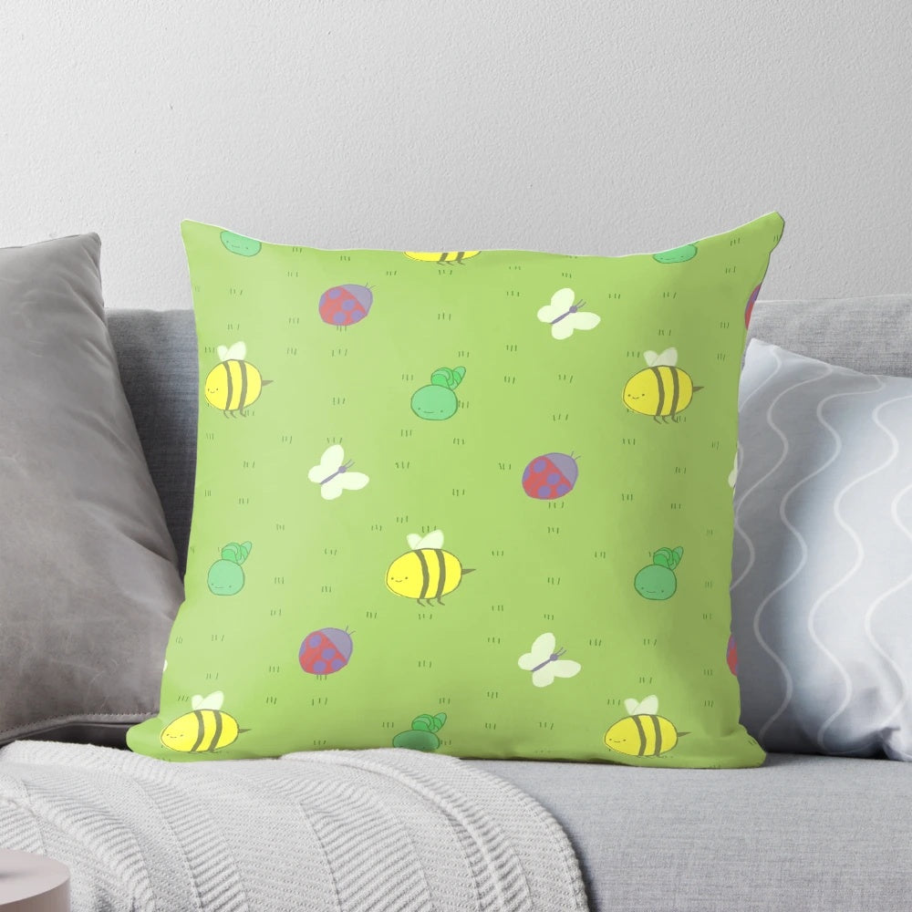 Adventure Time-inspired decorative pillow with a charming pattern of birds, bees, caterpillars, and ladybugs