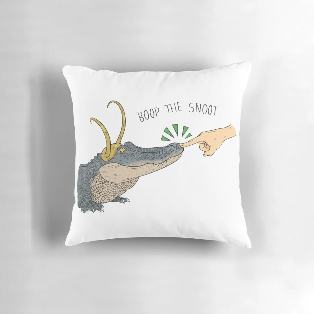 Cozy decorative pillow featuring an alligator character from the Loki series, with the text "Boop the Snoot"