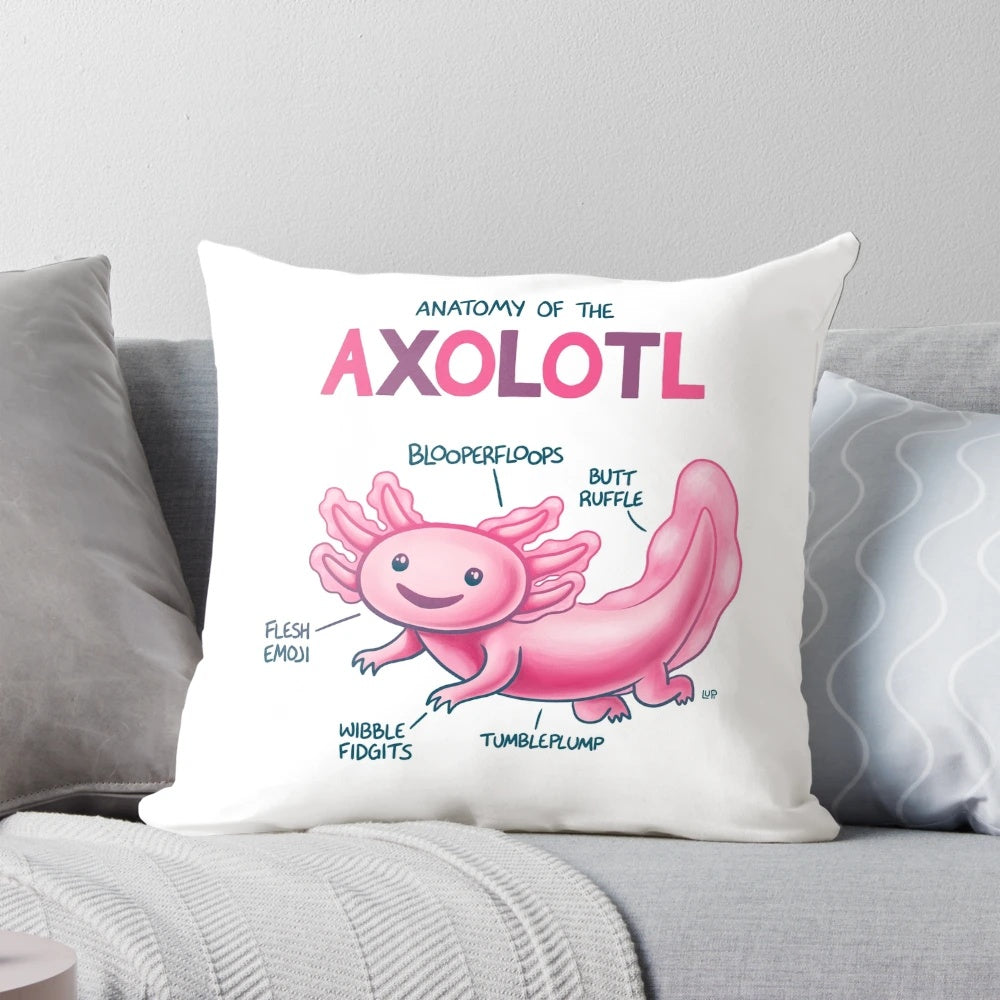 Colorful cartoon image of a pink axolotl with labeled anatomy features on a plush pillow