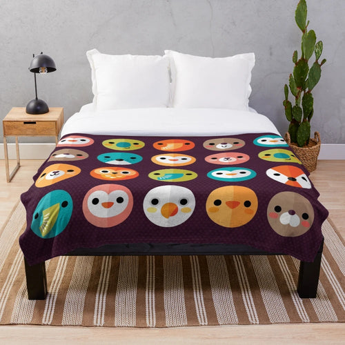 Smiley faces and cute animal designs on a soft, plush blanket