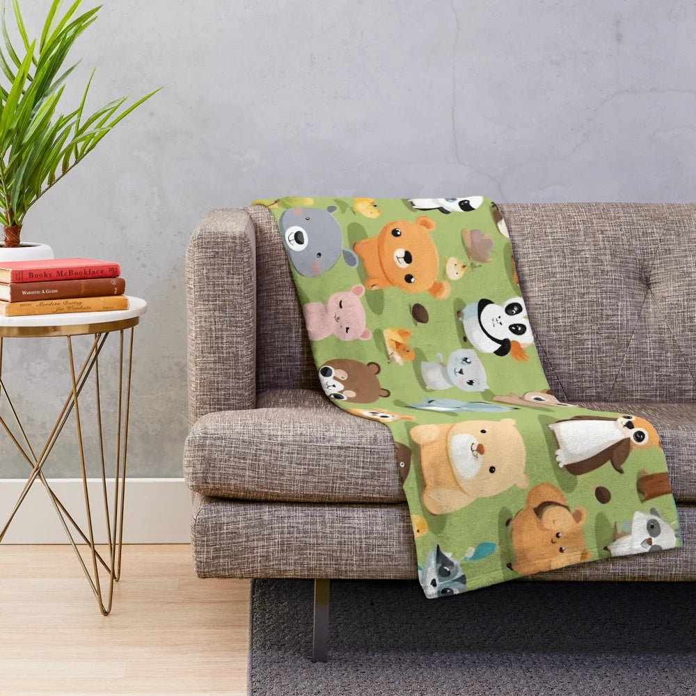 Plush animal blanket with cute forest animals on a playground