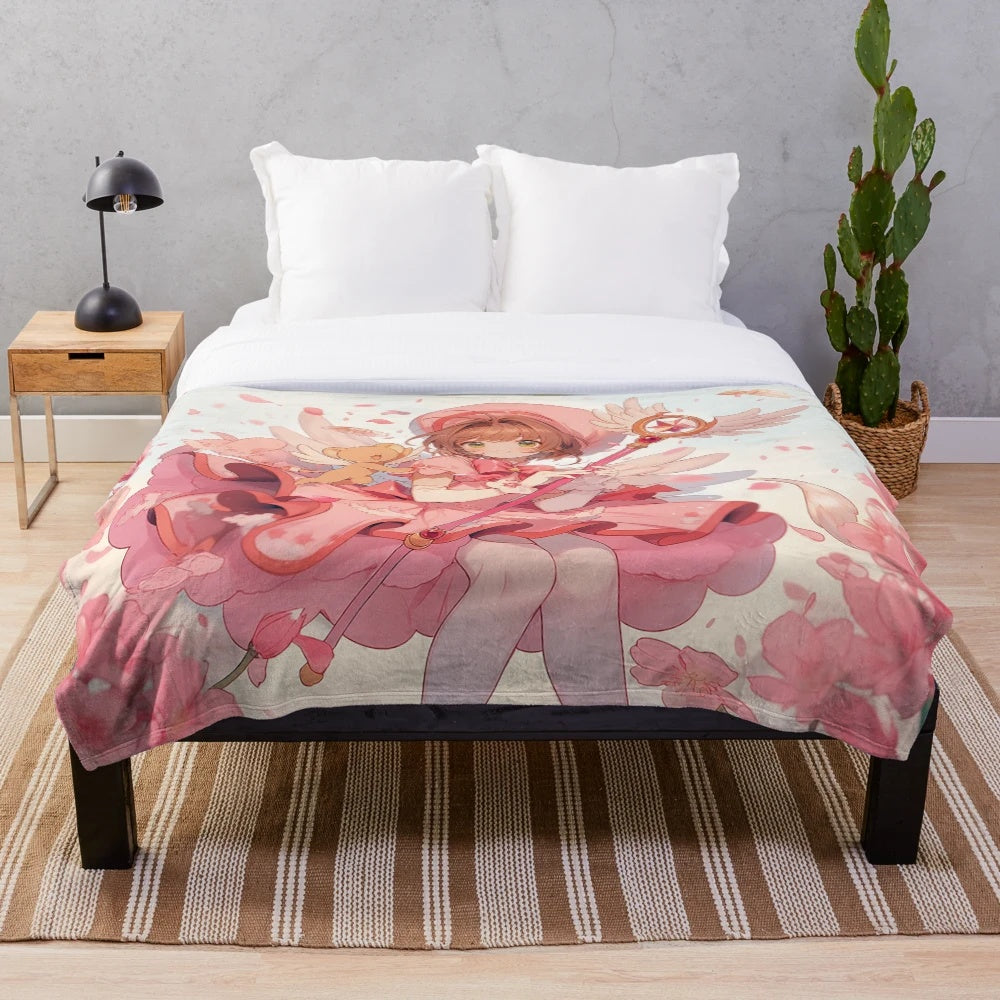 Soft, pink plush blanket featuring the characters Sakura and Kero from the popular anime series