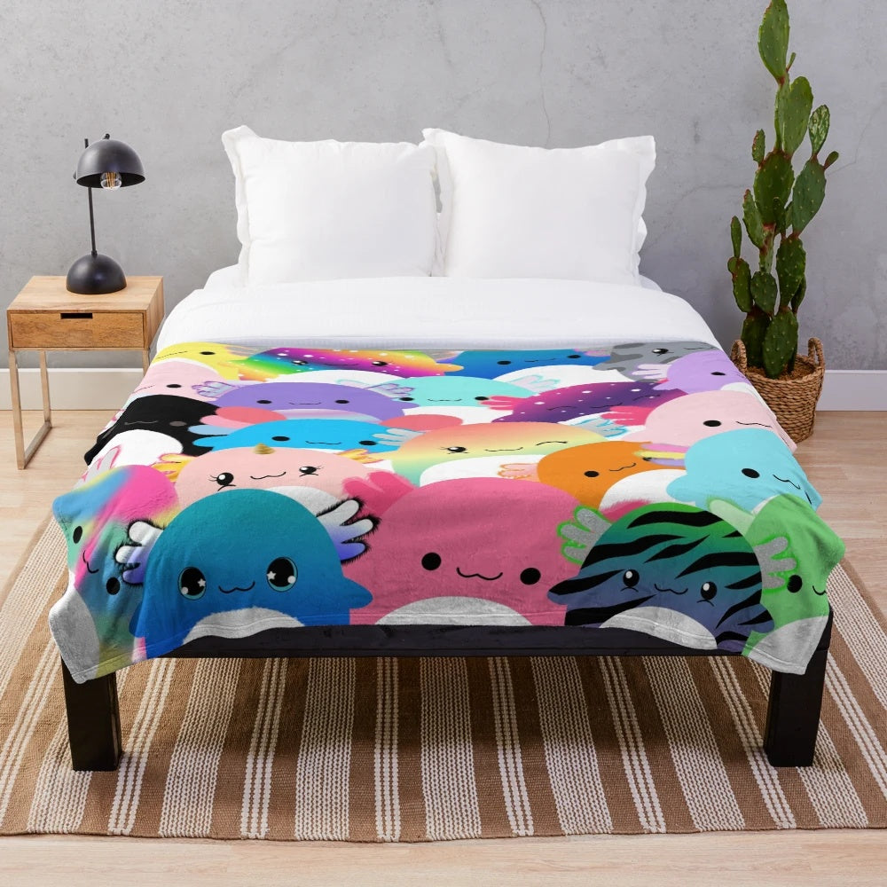 Colorful plush blanket featuring a family of cute axolotl creatures