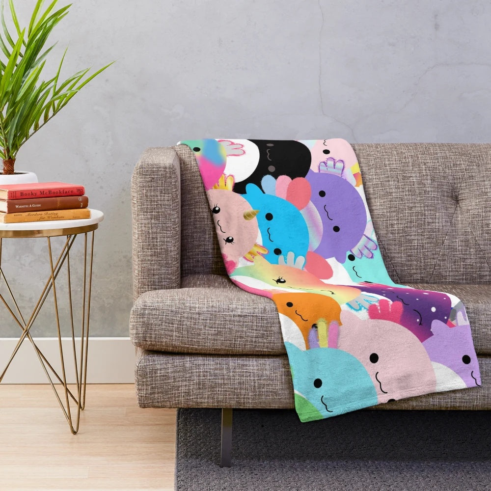 Colorful plush blanket featuring a family of cute axolotl creatures