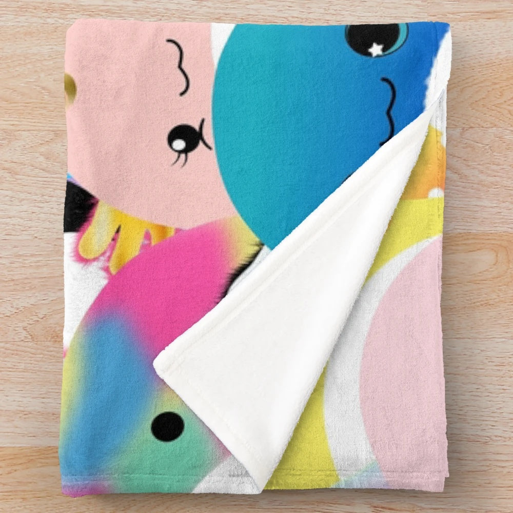 Colorful plush blanket featuring a family of cute axolotl creatures