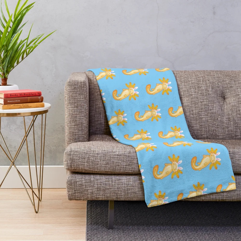 Cozy axolotl plush blanket with kawaii pattern and golden accents