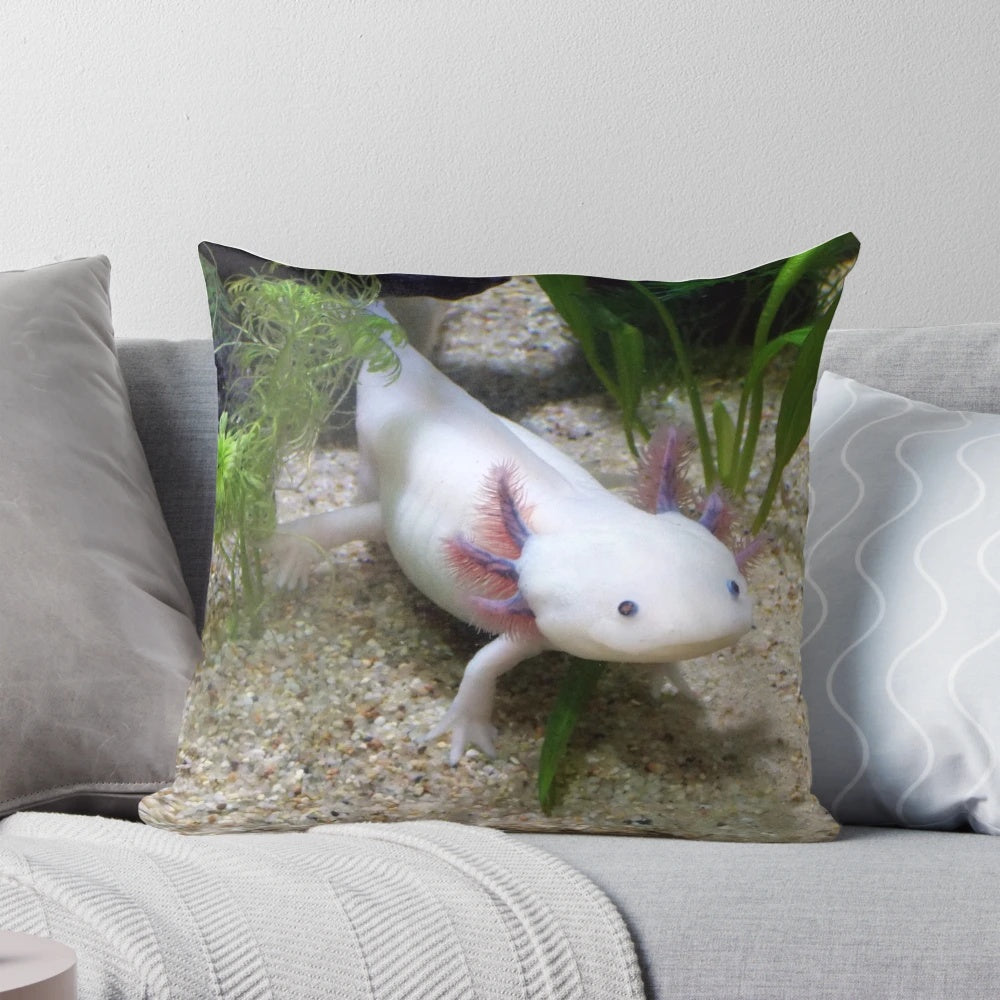 Soft, plush pillow featuring a cute, smiling axolotl design